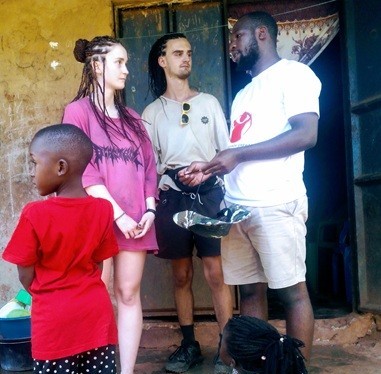 Guests sharing a meal in Bujagali